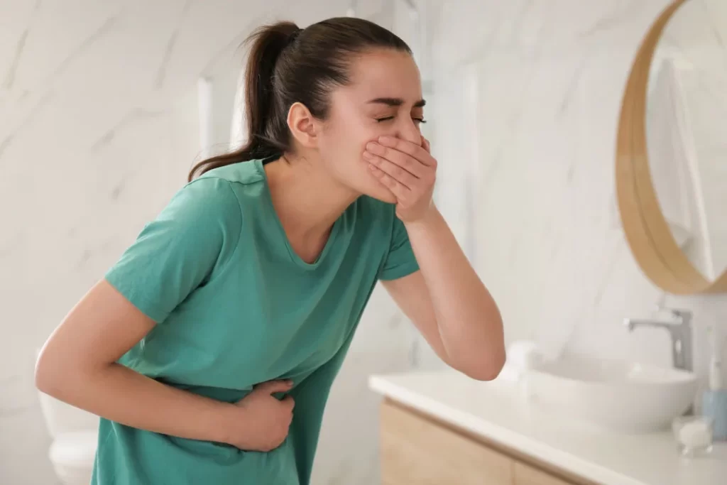 A young lady suffering from nausea. 