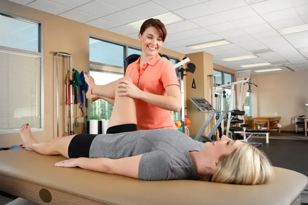 Lady helping other woman during exercise. 